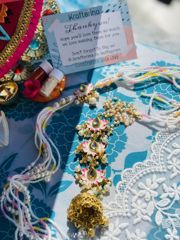 Lotus pearl rakhi set