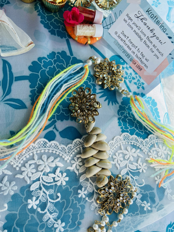Metal flower shell rakhi